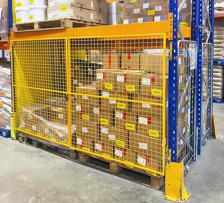 Quarantine area with yellow mesh doors on pallet racking 